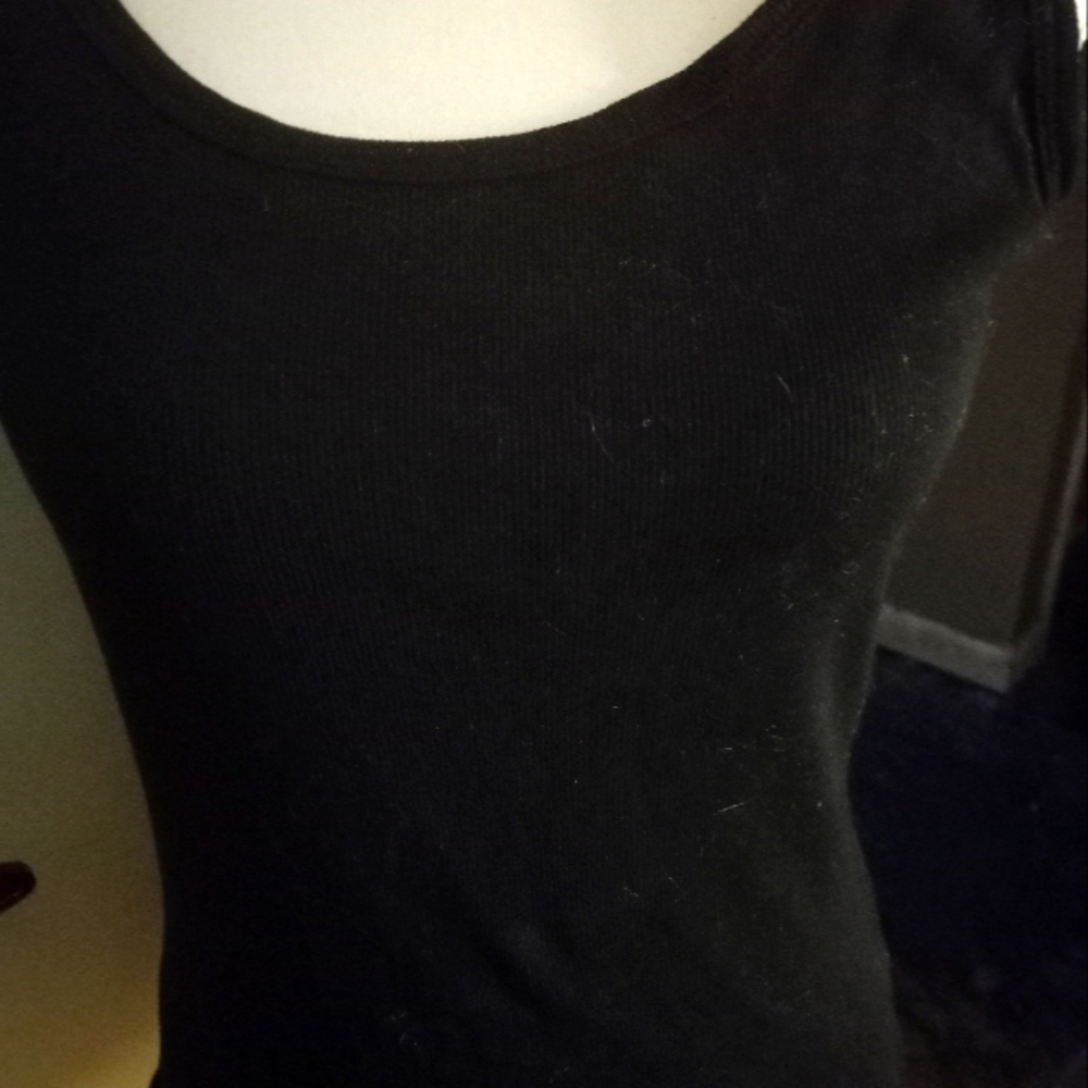 Used,not new black camisole/ tank top ribbed knit. size is medium.